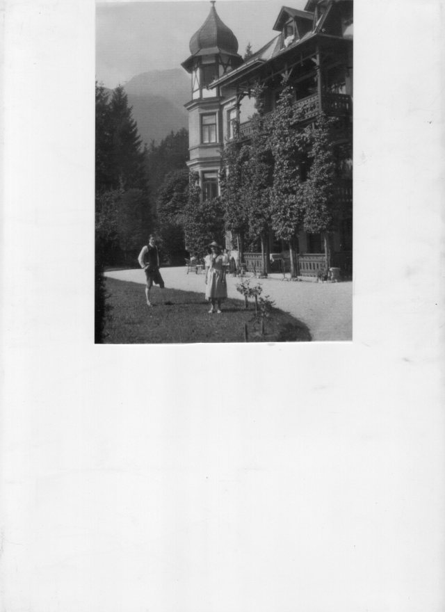 Villa Traun with family members on the lawn.